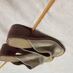 Cream Mules with Polished Finish and Elegant Silhouette
